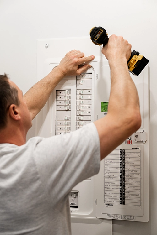 Jason installing an electrical panel