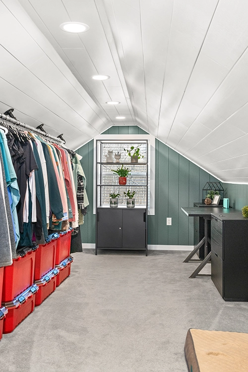 attic office room creation with storage, clothes, desk, and dog bed area